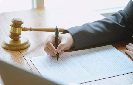 cropped-hands-man-writing-paper-desk